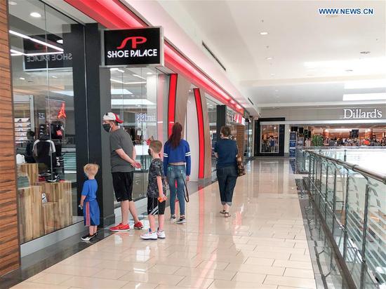 Shopping mall reopens with shortened business hours in Dallas