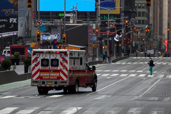An ambulance is seen at the Times Square in New York, the United States, on April 27, 2020. (Photo by Michael Nagle/Xinhua)