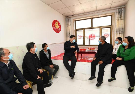 Chinese President Xi Jinping, also general secretary of the Communist Party of China Central Committee and chairman of the Central Military Commission, learns about poverty alleviation efforts in a village of Xiping Township in Datong City, north China's Shanxi Province, May 11, 2020. Xi inspected north China's Shanxi Province on Monday. (Xinhua/Xie Huanchi)