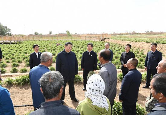 Chinese President Xi Jinping, also general secretary of the Communist Party of China Central Committee and chairman of the Central Military Commission, learns about poverty alleviation efforts at an organic daylily farm in Yunzhou District of Datong City, north China's Shanxi Province, May 11, 2020. Xi inspected north China's Shanxi Province on Monday. (Xinhua/Xie Huanchi)
