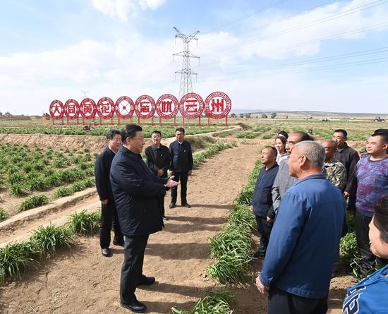 Chinese President Xi Jinping, also general secretary of the Communist Party of China Central Committee and chairman of the Central Military Commission, learns about poverty alleviation efforts at an organic daylily farm in Yunzhou District of Datong City, north China's Shanxi Province, May 11, 2020. (Xinhua/Li Xueren)