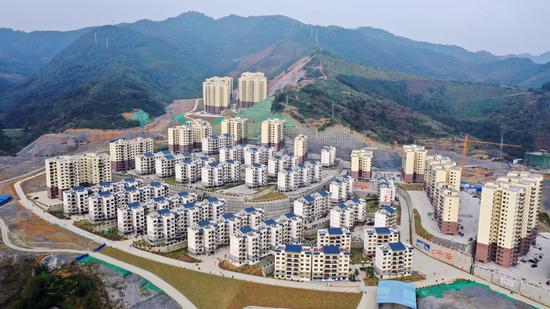 Aerial photo taken on Dec. 3, 2019 shows a poverty-relief resettlement site in Longlin County, south China's Guangxi Zhuang Autonomous Region. (Xinhua/Zhang Ailin)