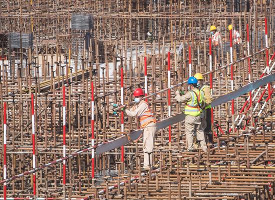 People work at the construction site of the Joy City building complex in Wuhan, central China's Hubei Province, April 28, 2020. (Xinhua/Xiao Yijiu)