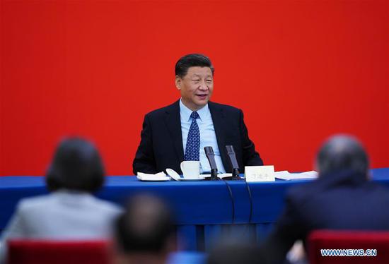 Chinese President Xi Jinping, also general secretary of the Communist Party of China (CPC) Central Committee and chairman of the Central Military Commission, visits national political advisors from the economic sector attending a joint panel discussion at the third session of the 13th National Committee of the Chinese People's Political Consultative Conference (CPPCC) in Beijing, capital of China, May 23, 2020. Xi joined them in the discussion and heard their comments and suggestions. Wang Yang, a member of the Standing Committee of the Political Bureau of the CPC Central Committee and chairman of the CPPCC National Committee, also attended the discussion. (Xinhua/Xie Huanchi)