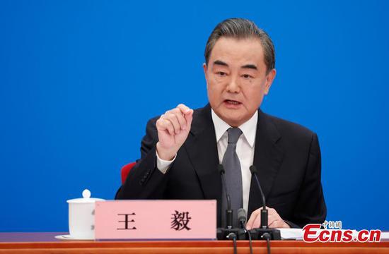 Chinese State Councilor and Foreign Minister Wang Yi attends a press conference on China's foreign policy and foreign relations via video link on the sidelines of the third session of the 13th National People's Congress at the Great Hall of the People in Beijing, capital of China, May 24, 2020. (Photo: China News Service/Du Yang)