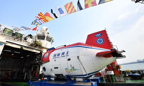 Photo taken on March 10, 2020 shows the manned submersible Shenhai Yongshi at Nanshan port in Sanya, south China's Hainan Province. China's science ship Tansuo-1 loaded with the manned submersible Shenhai Yongshi, or 