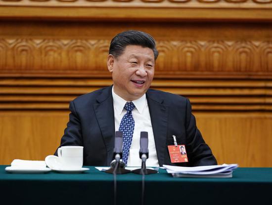 Chinese President Xi Jinping, also general secretary of the Communist Party of China Central Committee and chairman of the Central Military Commission, joins a deliberation with deputies from Hubei Province at the third session of the 13th National People's Congress in Beijing, capital of China, May 24, 2020. (Xinhua/Li Xueren)