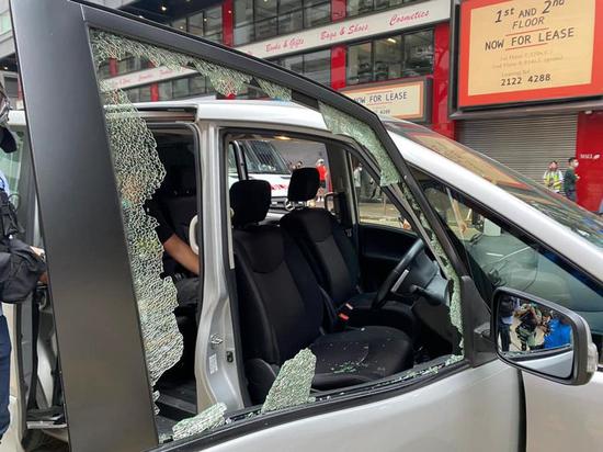 Rioters hit police vehicles with bricks and smashed the windshield of one car on May 24, 2020 in Hong Kong, China. (Photo from social media page of Hong Kong police)