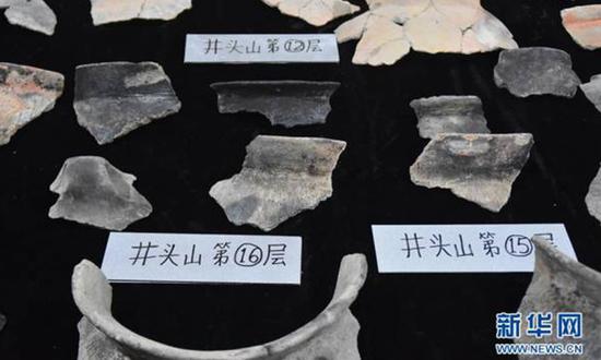 Pictured are items unearthed from the 8,000-year-old prehistoric shell mound in Yuyao, East China's Zhejiang province. (Photo/Xinhua)