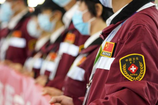 Members of a Chinese medical team attend a ceremony at Jiangbei International Airport in southwest China's Chongqing, May 13, 2020. (Xinhua/Liu Chan)