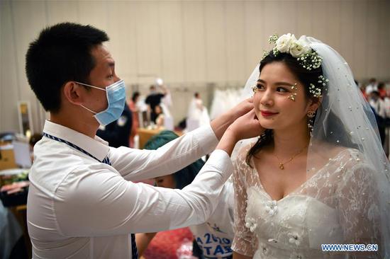 Group wedding ceremonies held for newly-married couples who once aided COVID-19 fight