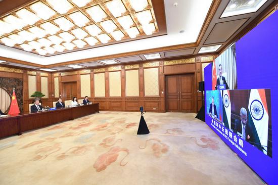 Chinese State Councilor and Foreign Minister Wang Yi attends a video conference with Russian Foreign Minister Sergey Lavrov and India's External Affairs Minister S. Jaishankar in Beijing, capital of China, June 23, 2020. (Xinhua/Yue Yuewei)