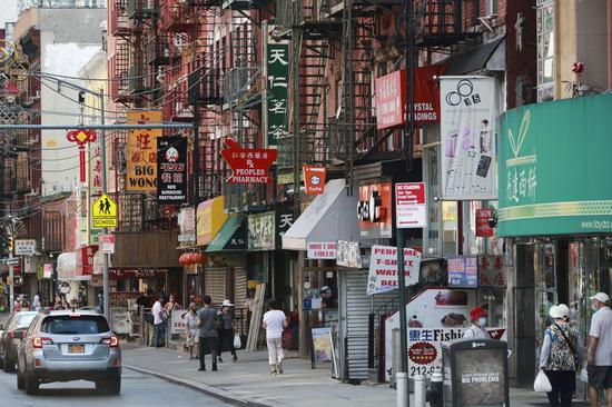 People walk in a street in Chinatown in Manhattan of New York, the United States, June 24, 2020. New York City entered phase two of reopening on June 22, marking a major milestone of the city's fight against COVID-19. (Xinhua/Wang Ying)