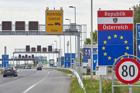 Vehicles are about to cross the border between Austria and Hungary to enter Nickelsdorf, Austria, on June 16, 2020. (Photo by Georges Schneider/Xinhua)