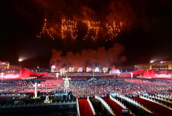 Fireworks explode during a grand evening gala marking the 70th founding anniversary of the People's Republic of China (PRC) in Beijing, capital of China, Oct. 1, 2019. (Xinhua/Lan Hongguang)