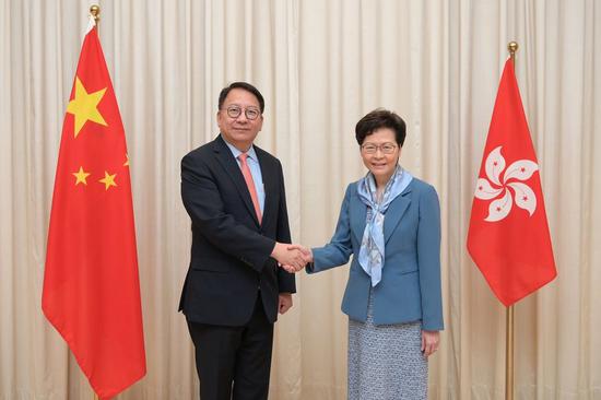Hong Kong Chief Executive Carrie Lam (right) congratulates newly appointed Secretary General of the Committee for Safeguarding National Security of the Hong Kong Special Administrative Region Chan Kwok-ki on his new appointment, Hong Kong, South China, July 2, 2020. (Photo courtesy of the HKSAR government)