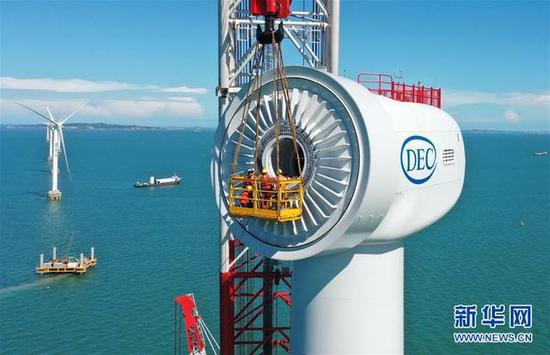 An offshore wind turbine with a capacity of 10 MW is under construction on June 12, 2020. (Photo/Xinhua)