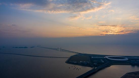 Aerial photo taken on Oct. 24, 2019 shows a morning view of an artificial island of the Hong Kong-Zhuhai-Macao Bridge, south China. (Xinhua/Cheong Kam Ka)