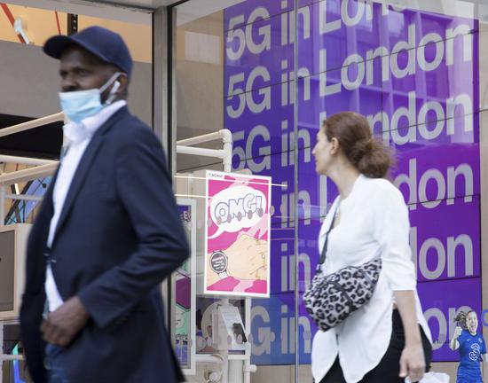 Photo taken on July 20, 2020 shows an advertisement for 5G at a Three store in London, Britain. (Photo by Tim Ireland/Xinhua)