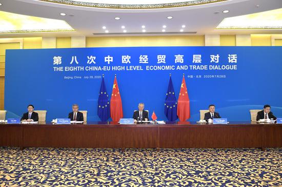 Chinese Vice Premier Liu He, also a member of the Political Bureau of the Communist Party of China Central Committee, co-chairs the 8th China-EU High-level Economic and Trade Dialogue with Valdis Dombrovskis, executive vice president of the European Commission, via video link on July 28, 2020. (Xinhua/Yue Yuewei)