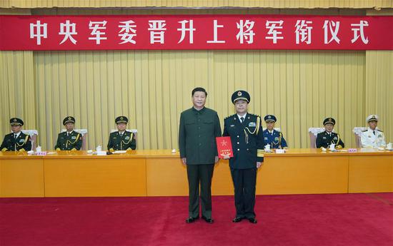 Xi Jinping, chairman of the Central Military Commission (CMC), presents a certificate of order at a ceremony to promote Xu Zhongbo, political commissar of the Rocket Force of the Chinese People's Liberation Army, to the rank of general, in Beijing, capital of China, July 29, 2020. The ceremony was held by the CMC in Beijing. (Xinhua/Li Gang)