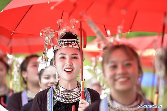 People of Zhuang ethnic group celebrate traditional diving festival in Guizhou