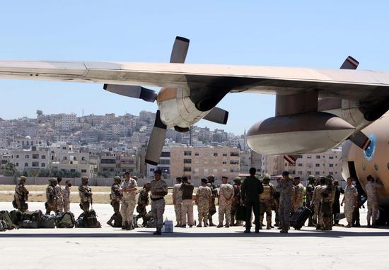 Members of Jordanian Military Field Hospital prepare to board a plane heading to Beirut at Marka Military Airport in Amman, Jordan, Aug. 6, 2020. (Xinhua/Mohammad Abu Ghosh)