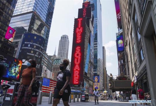 People walk in Times Square in New York, the United States, on Aug. 9, 2020. The total number of COVID-19 cases in the United States surpassed the 5 million mark on Sunday, according to the Center for Systems Science and Engineering (CSSE) at Johns Hopkins University. (Xinhua/Wang Ying)