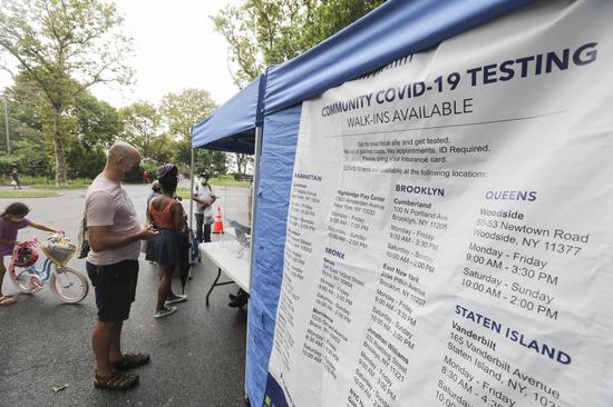 People wait to receive COVID-19 test at a temporary test site at Sunset Park of Brooklyn in New York, the United States, Aug. 13, 2020. (Xinhua/Wang Ying)