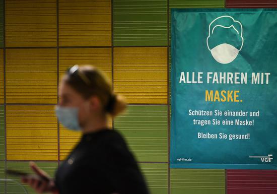 A sign reminding people to wear masks is seen at a subway station in Frankfurt, Germany, on Aug. 14, 2020. (Xinhua/Lu Yang)