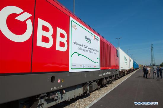 A freight train with "Made in Austria" goods leaves the Vienna South Terminal for China, in Vienna, Austria, on Aug. 20, 2020. A train loaded with fibers and pulp used for textiles pulled out of the Vienna South Terminal heading for China on Thursday, marking the first time a train with goods exclusively "Made in Austria" going from the Alpine country to China. (Photo by Georges Schneider/Xinhua)