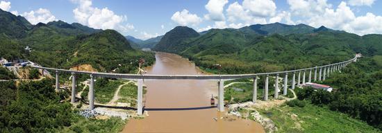 Aerial photo taken on July 24, 2020 shows the China-Laos Railway's Ban Ladhan Mekong River Super Major Bridge in Laos. (Photo by Pan Longzhu/Xinhua)
