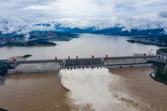 Aerial photo taken on Aug. 20, 2020 shows floodwater gushing out from the Three Gorges Dam in central China's Hubei Province. (Photo by Zheng Jiayu/Xinhua)