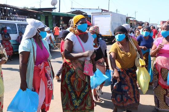 Women attend a face mask distribution ceremony in Maputo, Mozambique, on July 31, 2020. (Photo by Leo Pedro/Xinhua)