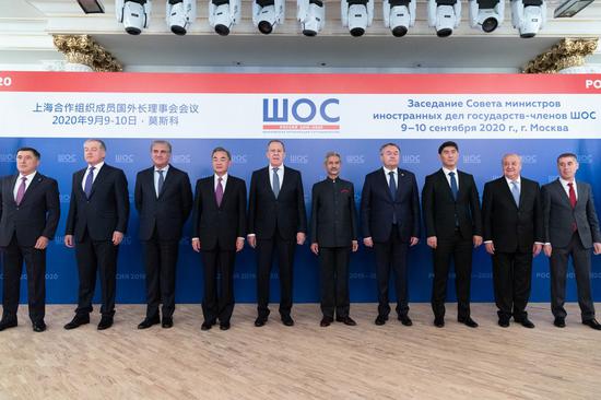 Chinese State Councilor and Foreign Minister Wang Yi (4th L) and other delegates pose for a photo ahead of a meeting of the Shanghai Cooperation Organization (SCO) Council of Foreign Ministers in Moscow, Russia, on Sept. 10, 2020. (Xinhua/Bai Xueqi)