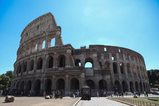 People walk outside the reopened Colosseum in Rome, Italy, June 1, 2020. The Colosseum monument reopened on Monday after having been closed since March 8, 2020 with adequate sanitary protection for staff and visitors, secure routes, compulsory reservations and modified schedules to avoid crowds at peak times. (Xinhua/Cheng Tingting)