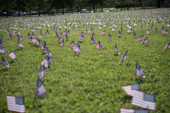 U.S. national flags representing the 200,000 lives lost to COVID-19 in the United States are placed on the National Mall in Washington, D.C., the United States, on Sept. 22, 2020. U.S. COVID-19 deaths surpassed 200,000 on Tuesday, according to the Center for Systems Science and Engineering (CSSE) at Johns Hopkins University. (Xinhua/Liu Jie)