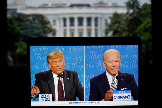 Photo taken in Arlington, Virginia, the United States, on Sept. 29, 2020 shows C-SPAN 2 live stream of U.S. President Donald Trump (L) and his Democratic challenger, Joe Biden, speaking during their first debate in the 2020 presidential race. (Xinhua/Liu Jie)
