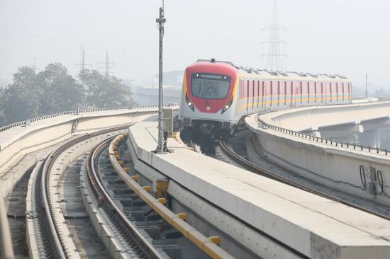 Photo taken on Oct. 24, 2020 shows an Orange Line metro train preparing for commercial operation in Pakistan's eastern city of Lahore. (Xinhua/Liu Tian)