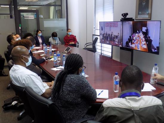 Members of Namibia's COVID-19 pandemic task team attend a video consultation conference with Chinese medical experts in Windhoek, Namibia, April 14, 2020. (Photo by Musa C Kaseke/Xinhua)