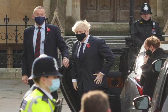 British Prime Minister Boris Johnson arrives at Westminster Abbey to attend a service to mark Armistice Day in London, Britain, Nov. 11, 2020. (Photo by Tim Ireland/Xinhua)