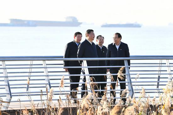 Chinese President Xi Jinping, also general secretary of the Communist Party of China Central Committee and chairman of the Central Military Commission, inspects local efforts in improving the overall environment along the shoreline of the Yangtze River, as well as the enforcement of fishing ban policies, at a riverside district in the city of Nantong, east China's Jiangsu Province, Nov. 12, 2020. (Xinhua/Xie Huanchi)