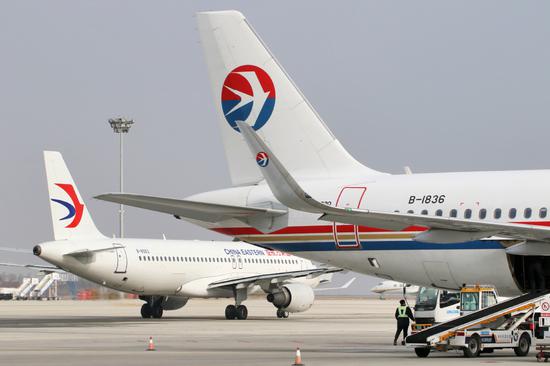 China Eastern Airlines' planes are on the tarmac at Yantai Penglai International Airport in Shandong province in January. (Photo by Tang Ke/For China Daily)