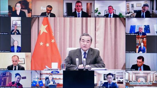 Chinese State Councilor and Foreign Minister Wang Yi attends a meeting with a delegation of board of directors of the U.S.-China Business Council via video link in Beijing, capital of China, Dec. 7, 2020. (Xinhua/Yue Yuewei)