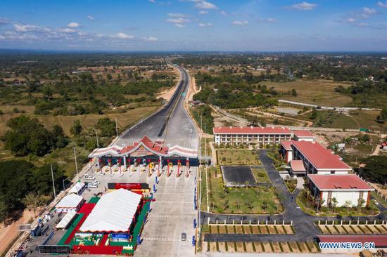 Aerial photo taken on Dec. 20, 2020 shows a view of the Vientiane-Vangvieng section of the China-Laos expressway in Vientiane, Laos. (Photo by Kaikeo Saiyasane/Xinhua)