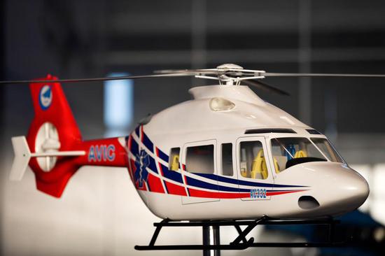Photo shows a model of the new AC332 civil helicopter displayed at the launch site, Dec. 29, 2020. (Xinhua/Li Ran)