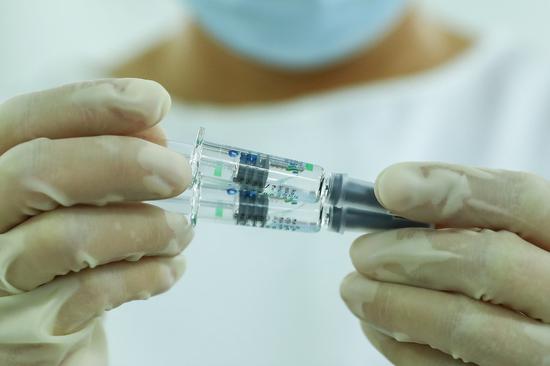 China approves self-developed COVID-19 vaccine