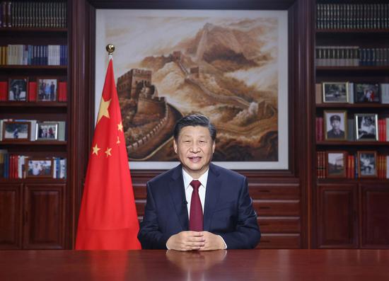 Chinese President Xi Jinping delivers a New Year speech Thursday evening in Beijing to ring in 2021. (Xinhua/Ju Peng)
