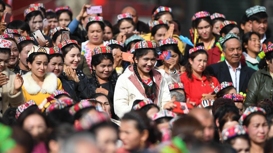 People attend a culture and tourism festival themed on Dolan and Qiuci culture in Awat County of Aksu Prefecture, northwest China's Xinjiang Uygur Autonomous Region, October 25, 2019. (Photo /Xinhua)