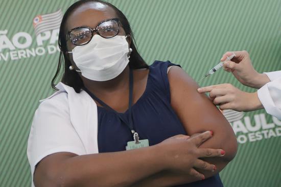 Brazilian nurse Monica Calazans receives the vaccine against COVID-19 in Sao Paulo, Brazil, on Jan. 17, 2021. (Xinhua/Rahel Patrasso)